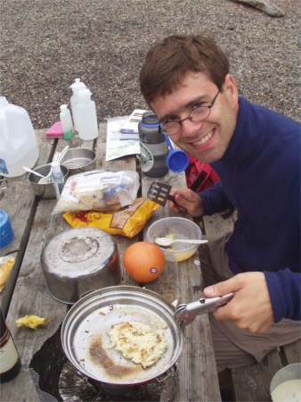 Tim cooking at Anderson Island Washington Water Trails Associatino WWTA campsite, Puget Sound, Washington