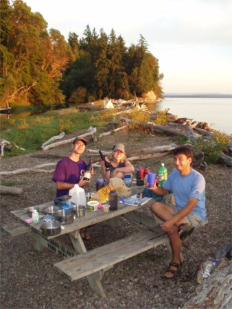 Tim, Emily, and Josh at picnic table at Anderson Island Washington Water Trails Associatino WWTA campsite, Puget Sound, Washington