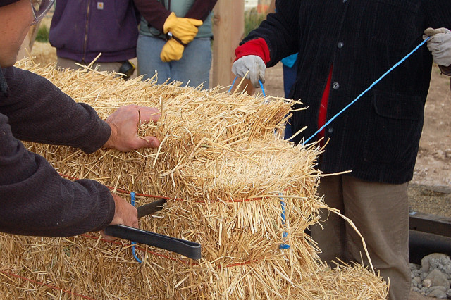 Strawbale Construction Workshop Of Ellensburge Barn, Sewing Needle Through The Bales