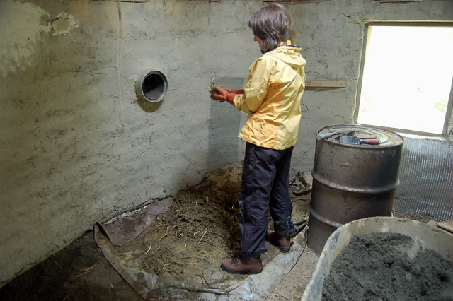 Hand Mixing Cob For Application Around The Rocket Stove