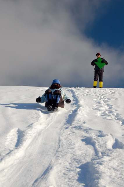 Aliza Butt Sledding Down Keechelus Lake Dam