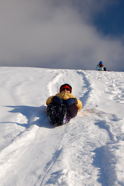 Karen Butt Sledding Down Keechelus Lake Dam