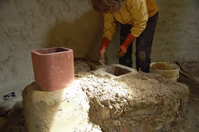 Thermal Mass And Insulation Provided By Cob, Brick, Rocks, And Sand