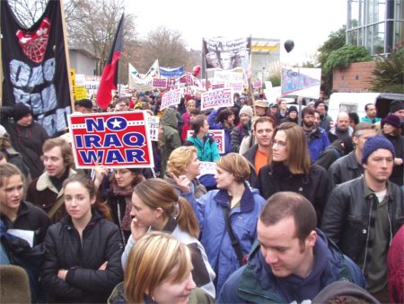 Crowd Marching Through Streets Of Seattle Demonstrating In Opposition To Iraq War