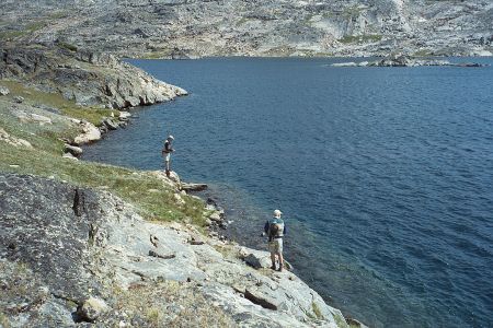 Brian And Dad Fly Fishing From Shore Of Fossil Lake In Beartooth Mountains Of Montana