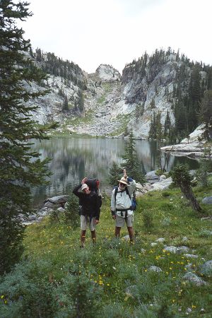 Brian And Dad Doing The Fish Call By Lake In Beartooth Mountains Of Montana