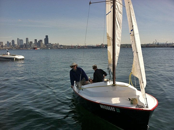 Sailboat arriving at Don Armeni Boat Ramp West Seattle Alki Beach boat launch on Harbor Avenue