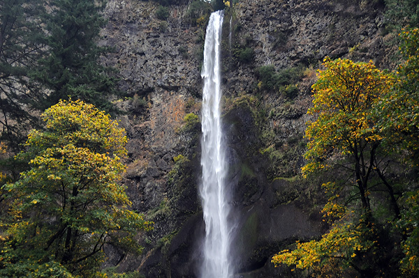 Multnomah Falls upper waterfall with fall foliage color on trees