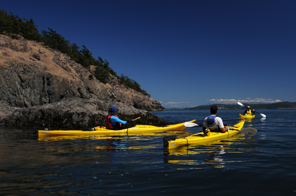 Kayakers by James Island State Park in San Juan Islands on Puget Sound