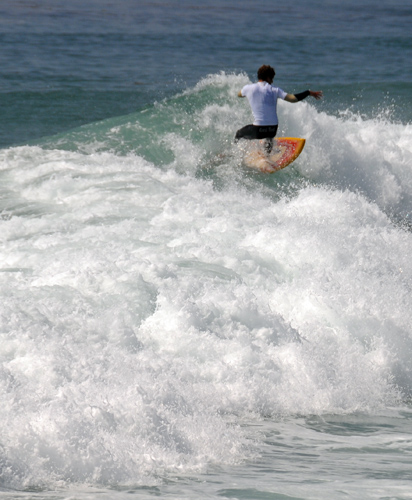 Salt Creek Beach Park surfer riding between crashing waves