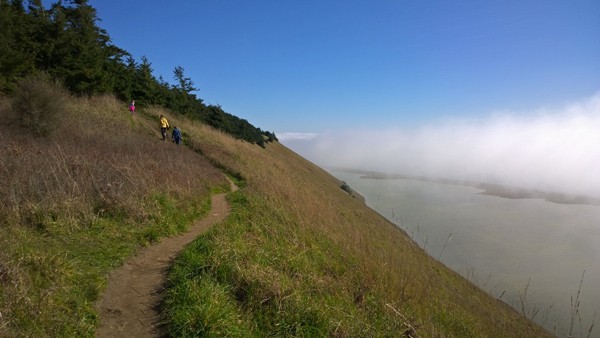 Hiking to top of bluff above Parego's Lagoon in Ebey's Reserve of Coupeville on Whidbey Island