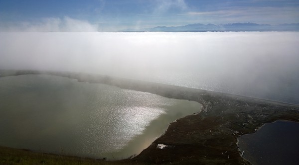View from Ebey's Reserve above Parego's Lagoon near Ebey's Landing to fog and Olympic Mountains
