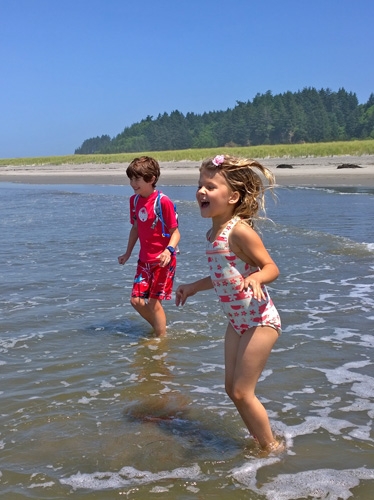Cape Disappointment State Park beach swimmers playing in waves