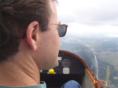 Scott admiring the view while flying the glider above Arlington, Washington