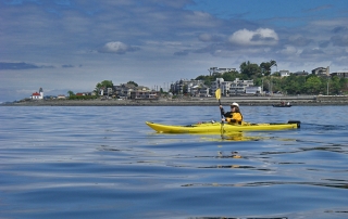 Sea Kayaking From West Seattle South Of Alki Point Lighthouse And Alki Beach