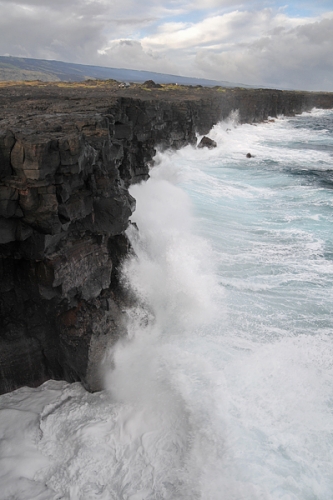 Pacific Ocean Waves Crashing Into Cliffs At Bottom Of Chain Of Craters Road In Hawaii Volcanoes National Park