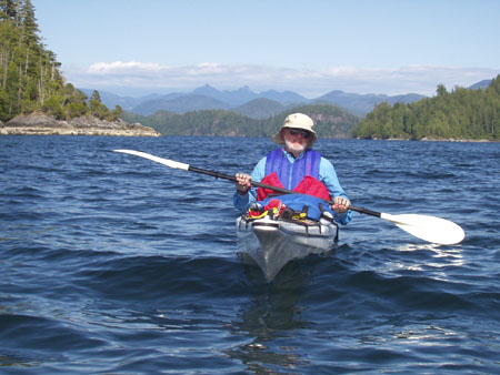 Dad Kayaking Between Islands In Barkley Sound, Deer Group Islands, Vancouver Island, British Columbia, Canada