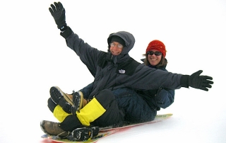 Hyak Sled Hill At Snoqualmie Pass Snow Park, Scott And Karen Sledding (Photo By Josh)