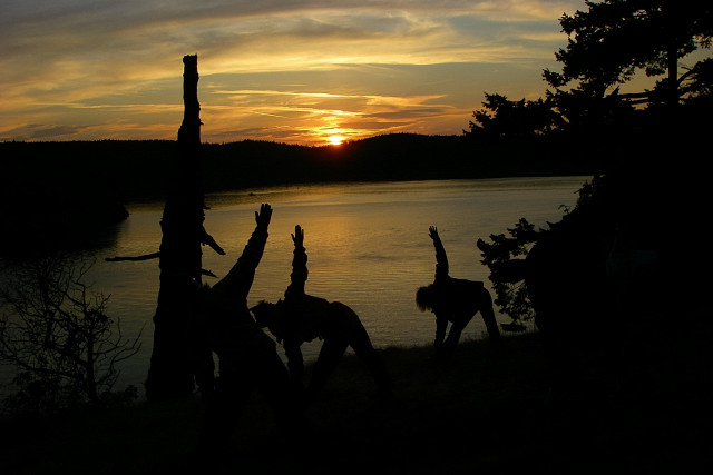 Yoga Stretching At Sunset On James Island State Park, San Juan Islands