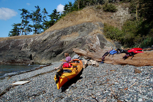 Resting On Rock Beach Cove Of Lopez Islance Iceberg PointBLM land With kayak