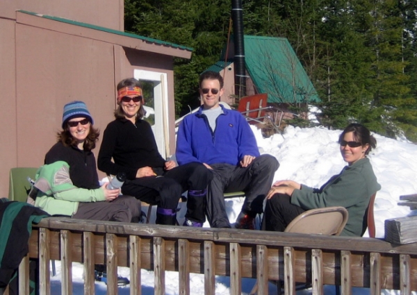 Aliza, Karen, Scott, And Lori On Snow-Covered Deck Of MTTA Copper Creek Hut By Mt. Rainier