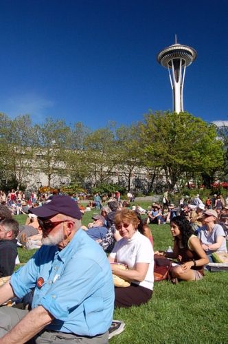 Seattle Northwest Folklife Festival Watching Fiddler Performance At Seattle Center Fisher With Space Needle In Background
