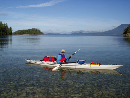 Dad And Kayak In Holford Bay South Of Gattle Point Of Tzartus Island, Deer Group, Vancouver Island, British Columbia, Canada