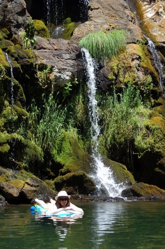 Sunbathing On Raft At Waterfall