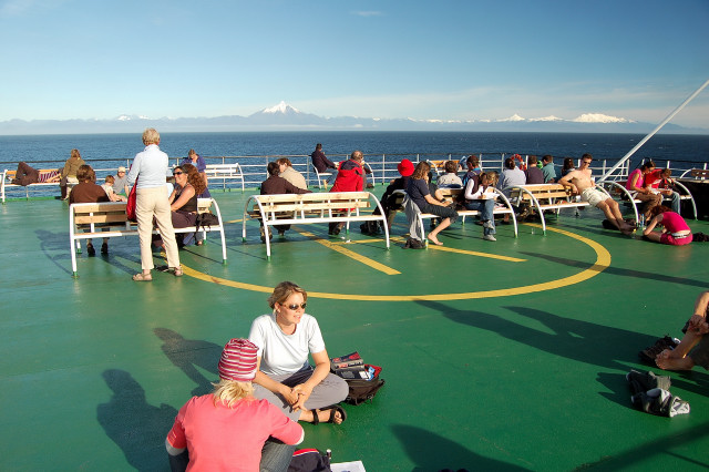 Sunny Day On Top Deck Of Navimag Ferry Magallenes With Andes Mountains And Volcanoes In Background, Pacific Ocean Off Of Chile