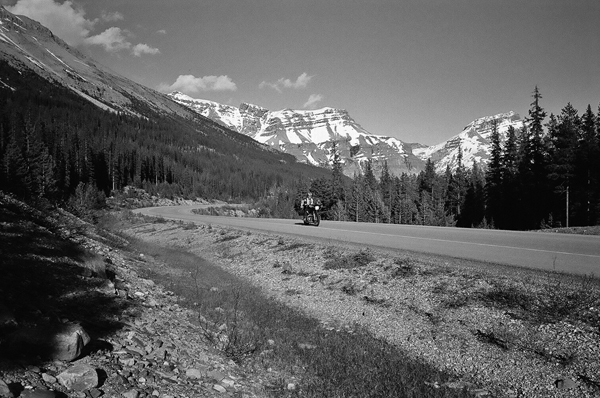 Banff National Park In Alberta Canada Riding Motorcyles On Road Through Mountains