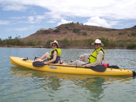 Karen And Scott Kayaking In Salt River Bay With Villa Soleil On Hill Above, St. Croix, Virgin Islands