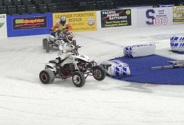 Ice Racing Championship Series 4 wheel ATVs in corner at Everett Xfinity Arena