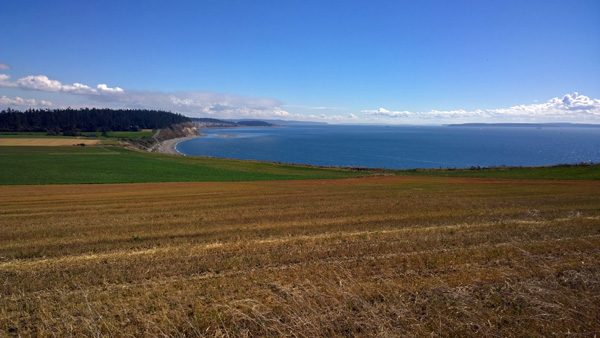 Ebey's Prairie Trail view to Ebey's Landing State Park, farm land, and Puget Sound