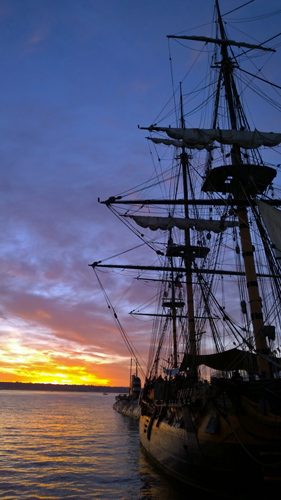 Sunset over Surprise sailing ship and Soviet submarine at Maritime Museum of San Diego