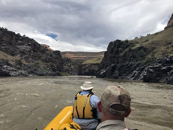 Rafting dark rock walls of Westwater Canyon on Colorado River Utah