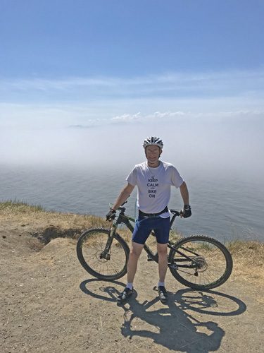 Mountain bike with fog over Puget Sound from Fort Ebey State Park bluff