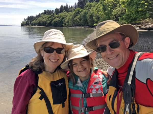 On beach by kayak at Dugualla State Park on Whidbey Island