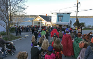 2019-10-26 Friends walking with crowd in Coupeville Halloween Torchlight Parade